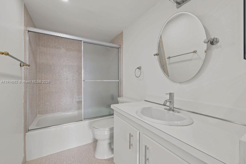 4174 Inverrary Drive, Unit 902 Lauderhill, FL 33319 - Photo 17 of 19 a bathroom with a sink a toilet and shower