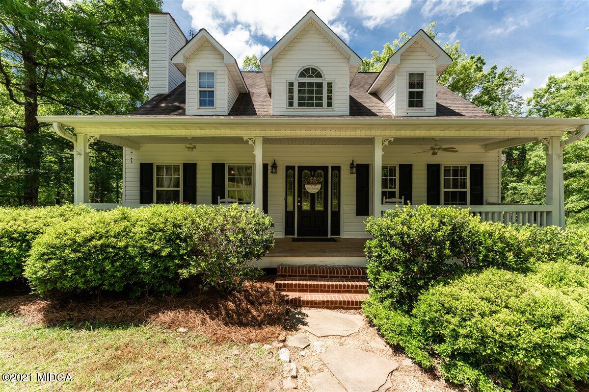 199 Woods Road Juliette, GA 31046 - Photo 1 of 38 front view of a house with a yard
