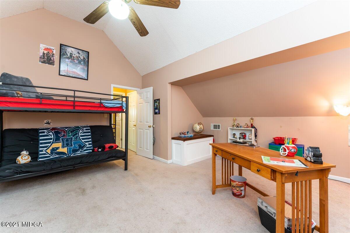 199 Woods Road Juliette, GA 31046 - Photo 26 of 38 a room with furniture and a fireplace