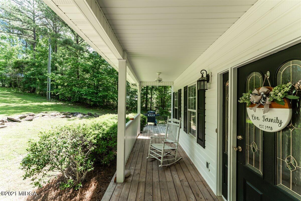 199 Woods Road Juliette, GA 31046 - Photo 5 of 38 a view of a chairs and table in a balcony