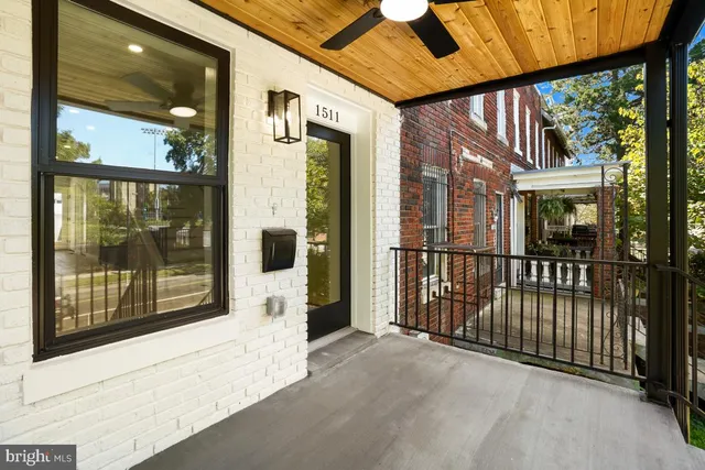 a view of a balcony with a floor to ceiling window