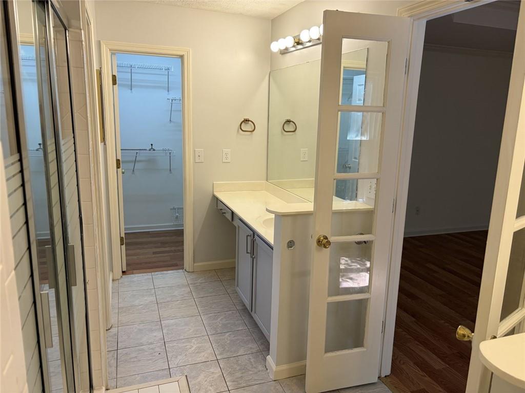 3089 Commons Crossing Snellville, GA 30078 - Photo 8 of 16 a bathroom with a shower and a sink