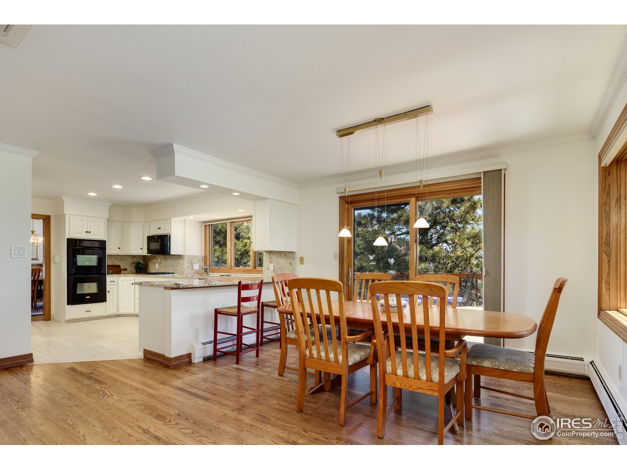 2371 Linden Drive Boulder, CO 80304 - Photo 16 of 40 a view of a dining room with furniture window and wooden floor