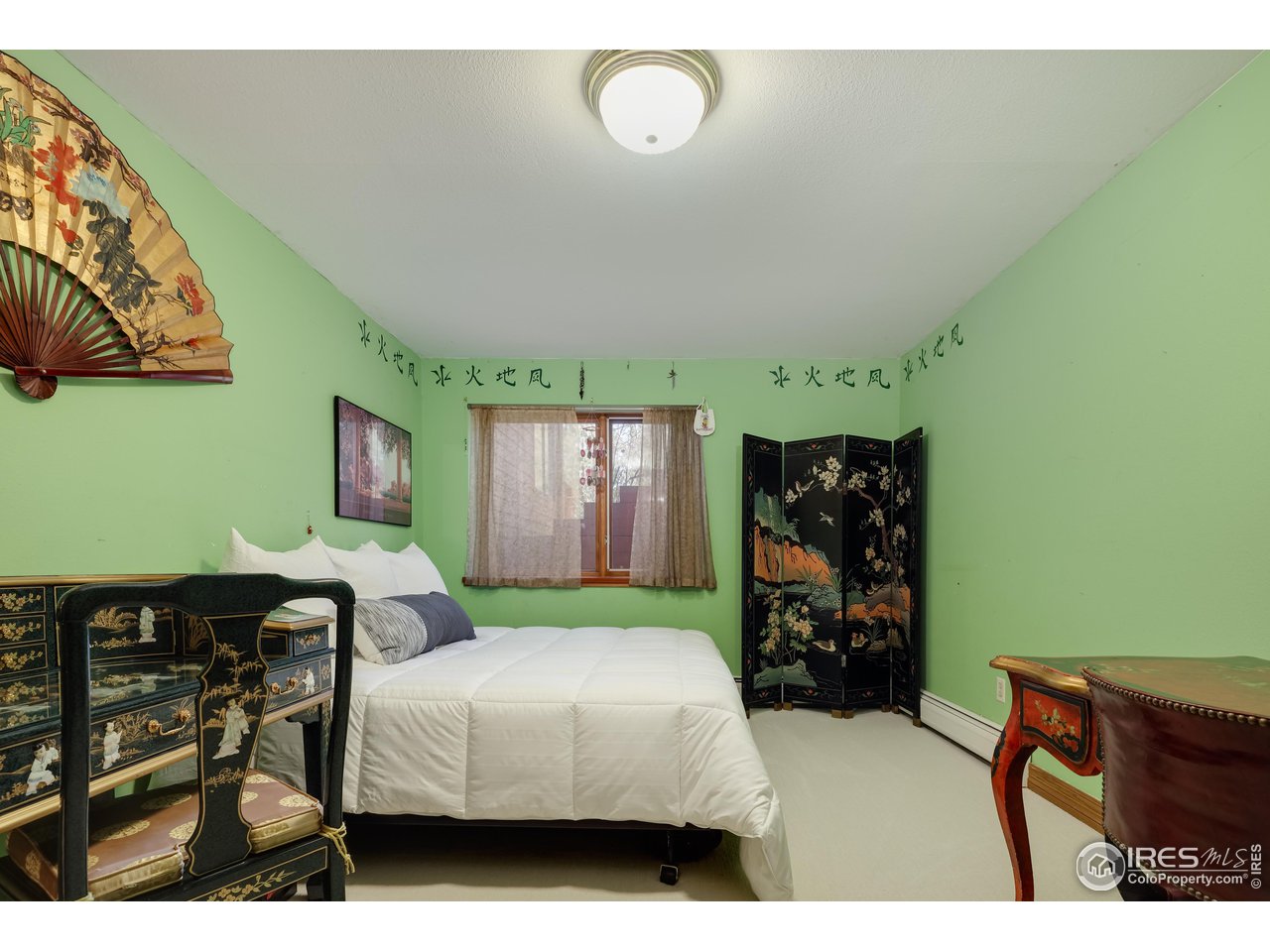 2371 Linden Drive Boulder, CO 80304 - Photo 30 of 40 a bedroom with furniture and a fireplace