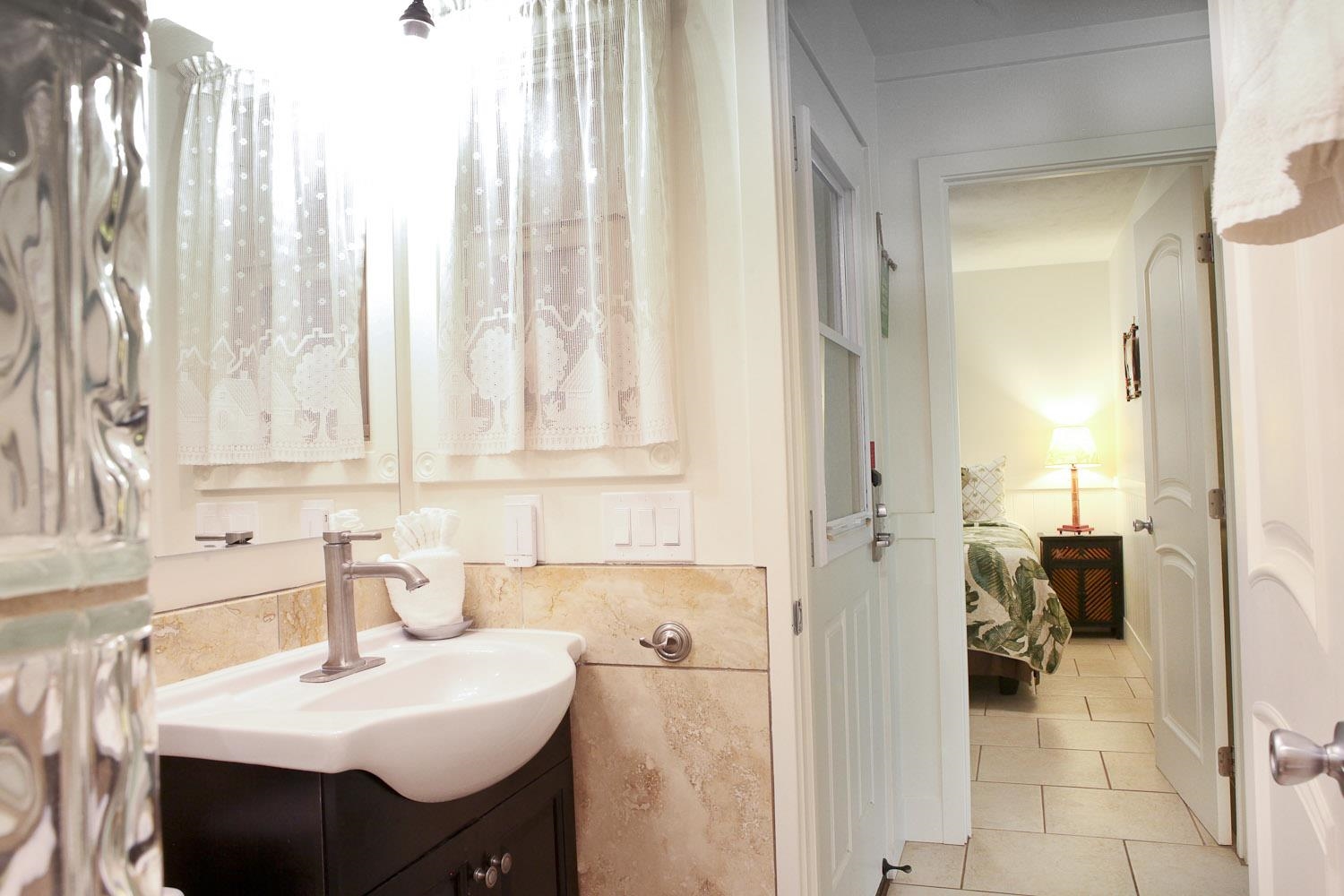 115 North Kihei Road, Unit A3 Kihei, HI 96753 - Photo 12 of 21 a bathroom with a sink vanity and a mirror