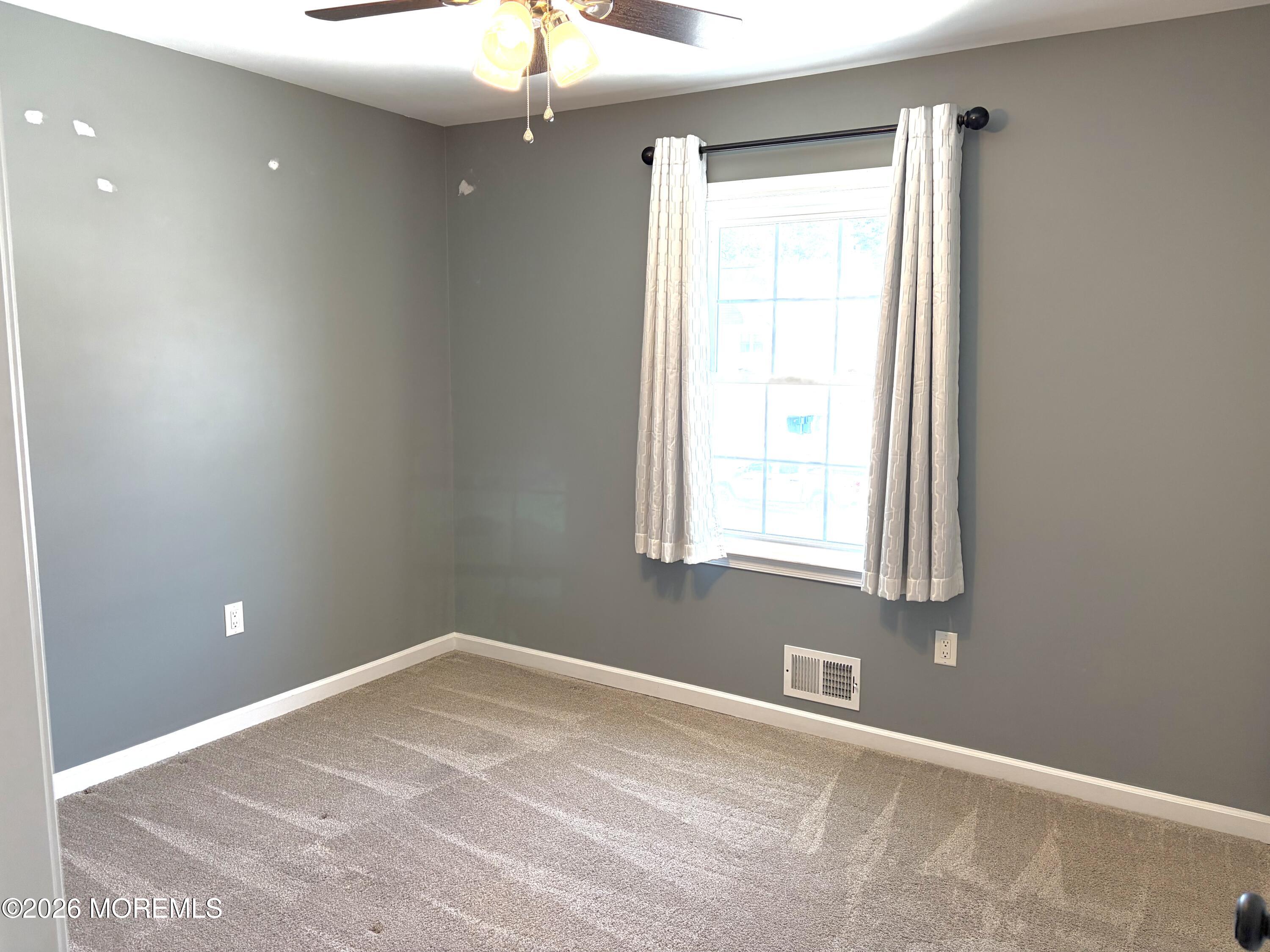 295 Flaam Street Toms River, NJ 08753 - Photo 22 of 30 a view of an empty room with a window
