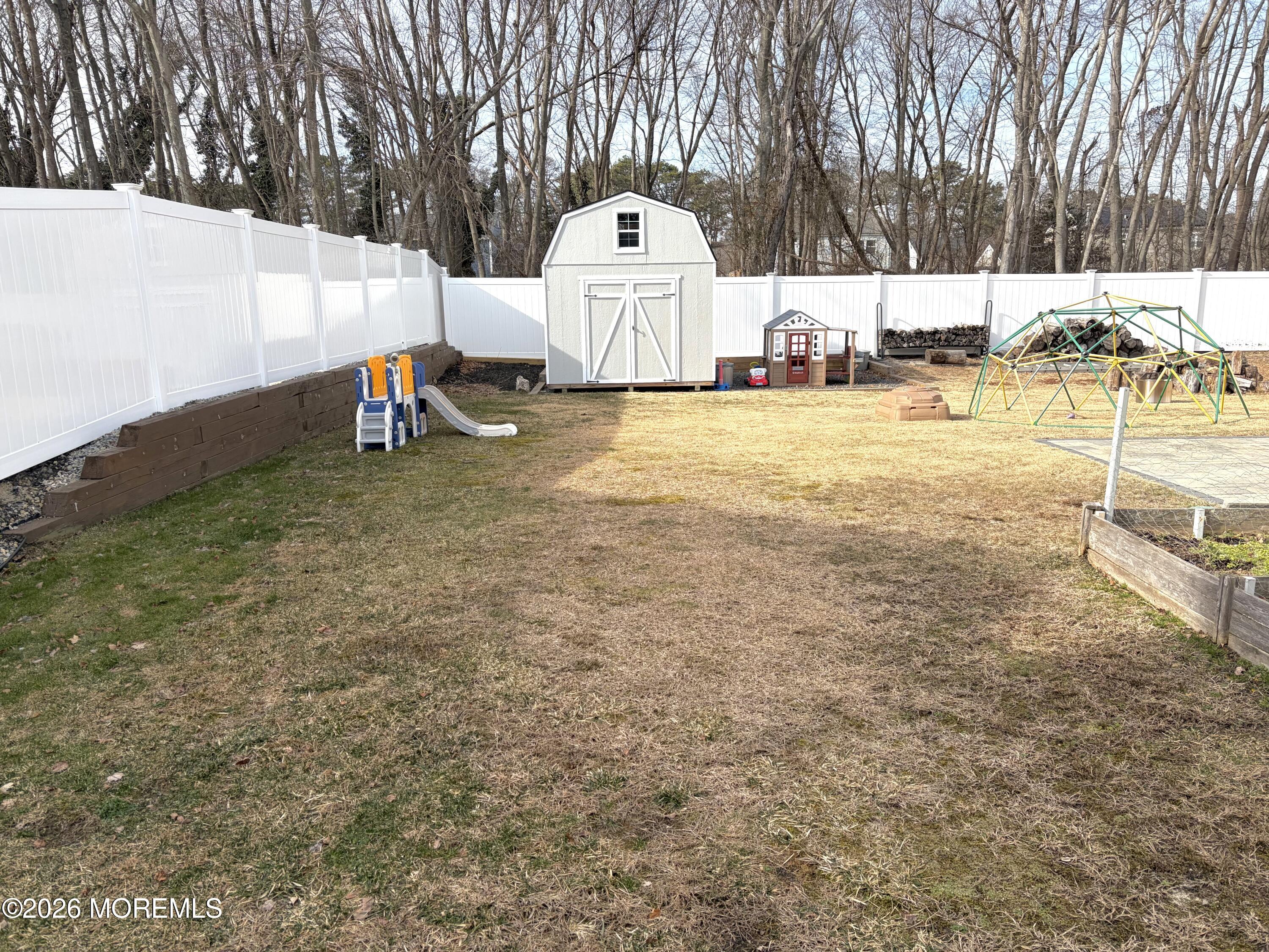 295 Flaam Street Toms River, NJ 08753 - Photo 28 of 30 a view of a house with a yard