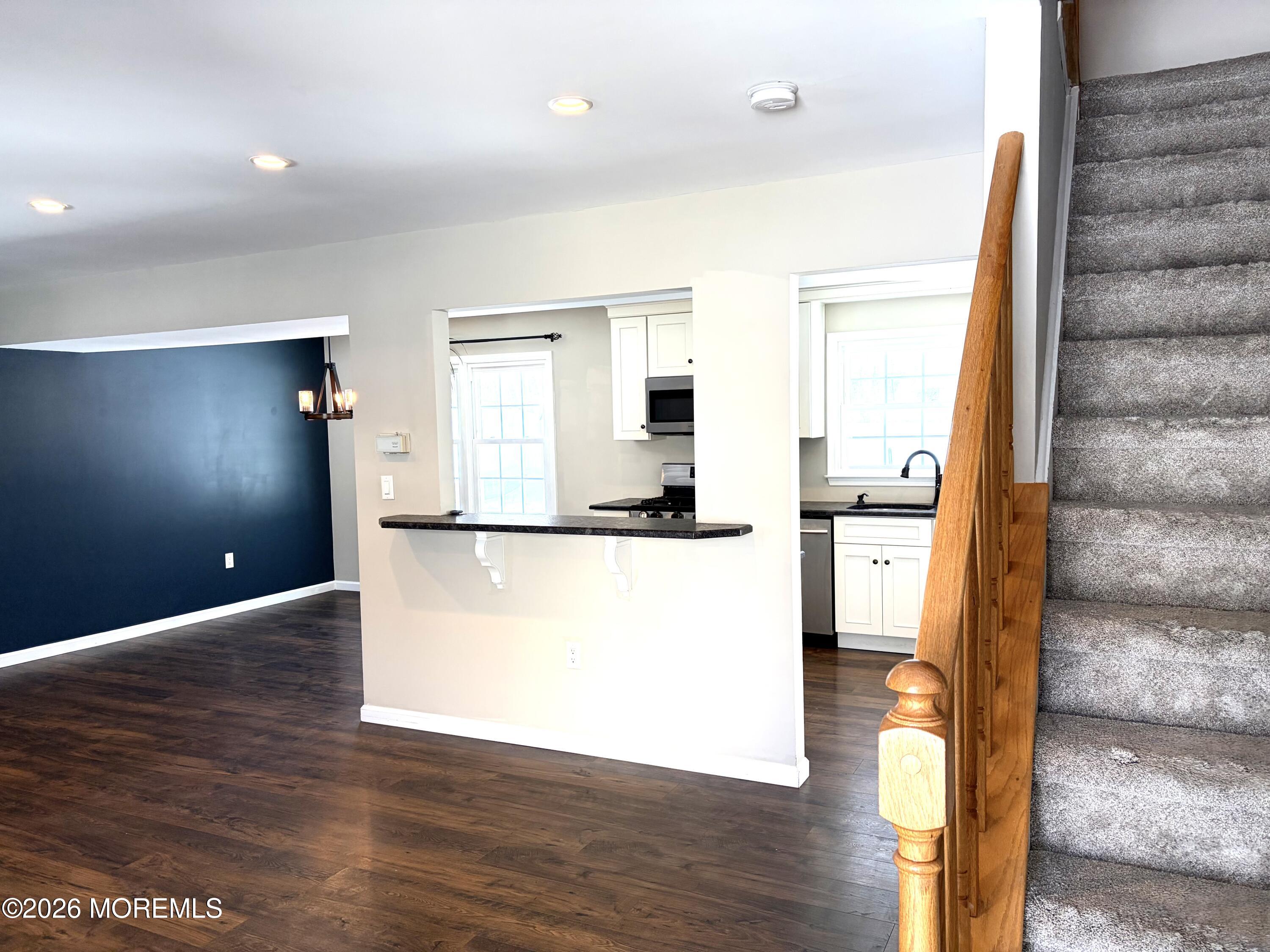 295 Flaam Street Toms River, NJ 08753 - Photo 5 of 30 a view of kitchen with furniture and wooden floor