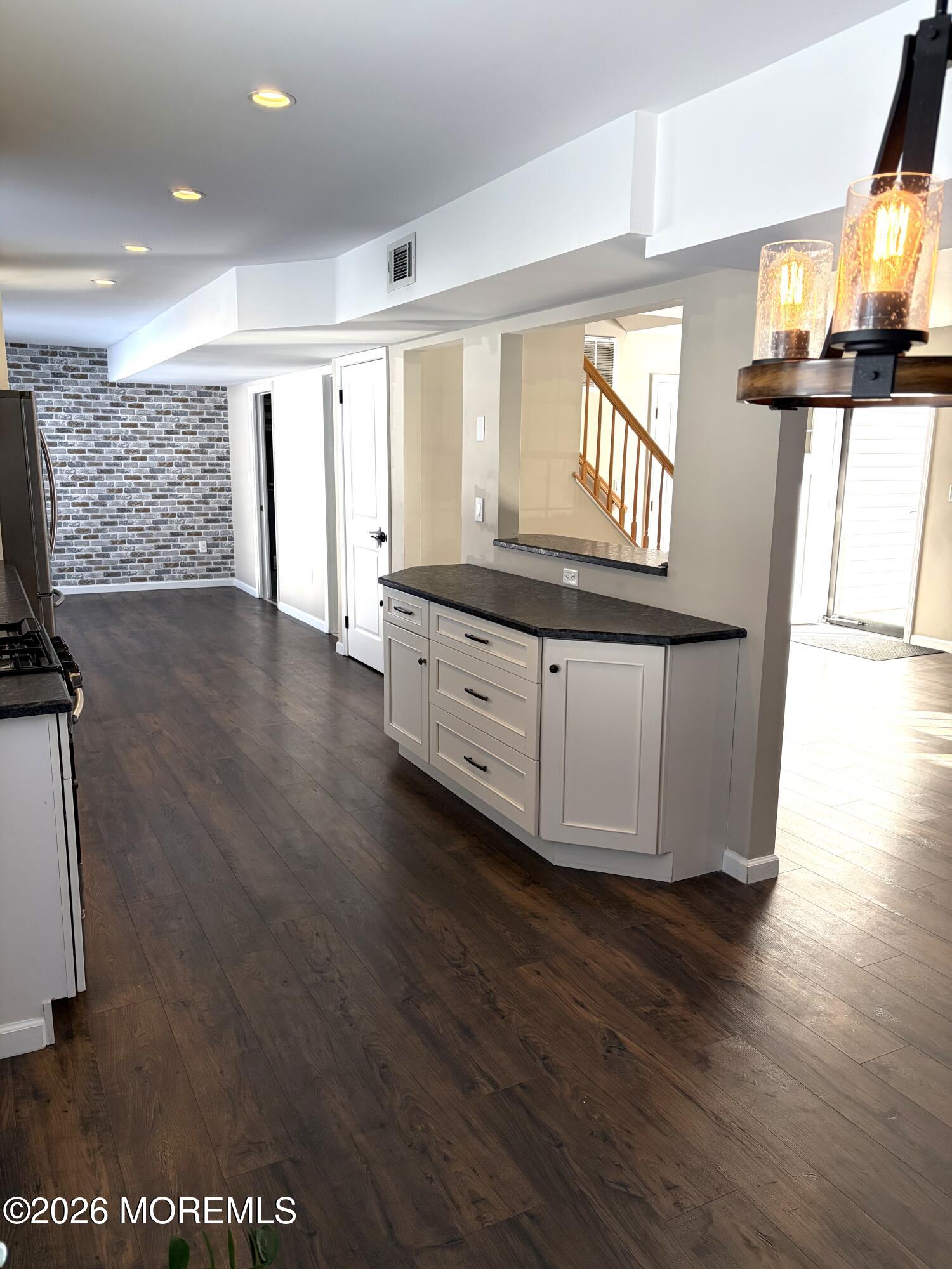295 Flaam Street Toms River, NJ 08753 - Photo 7 of 30 a view of kitchen and hall with wooden floor