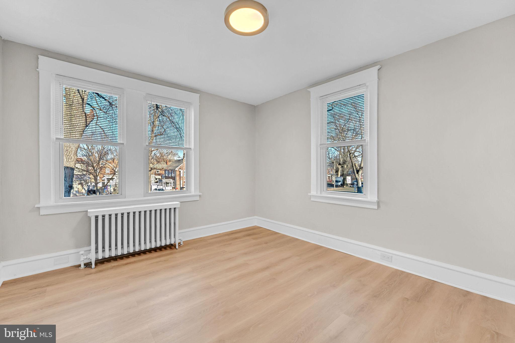 2791 Yorkship Road Camden, NJ 08104 - Photo 16 of 33 a view of an empty room with window and wooden floor