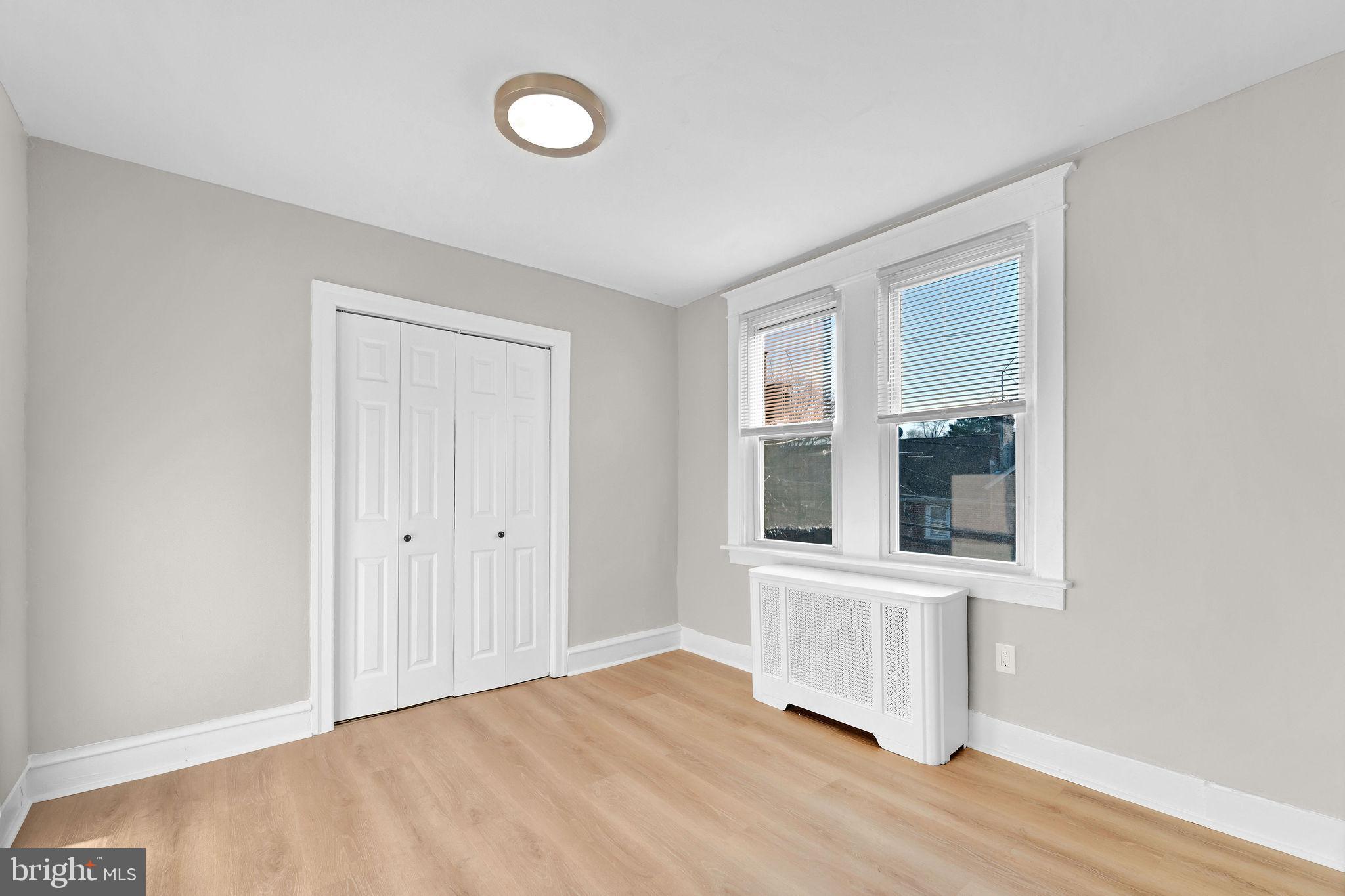 2791 Yorkship Road Camden, NJ 08104 - Photo 21 of 33 a view of an empty room with wooden floor and a window