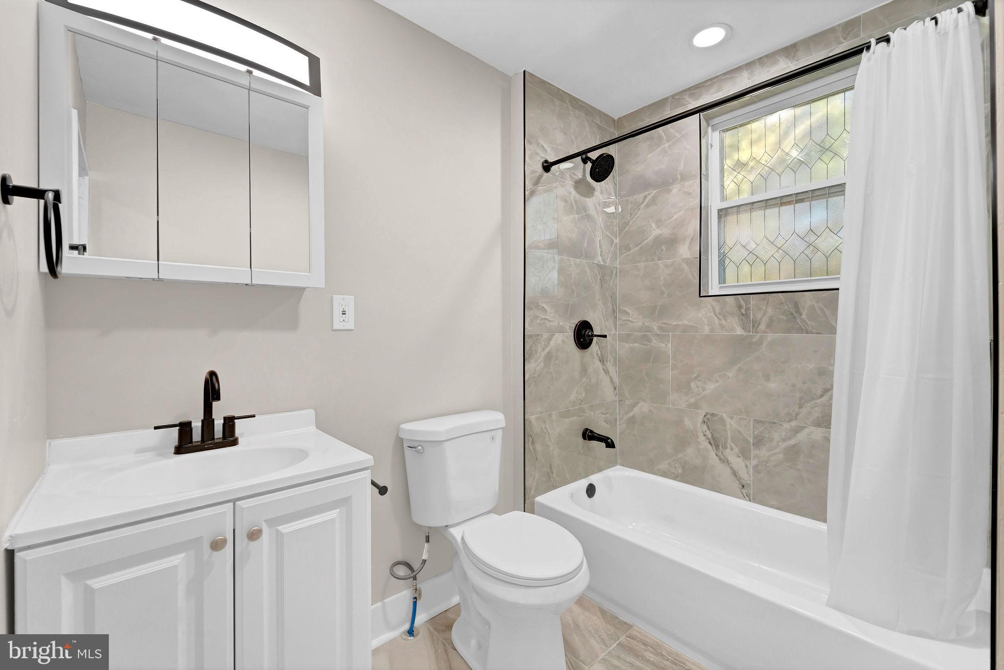 2791 Yorkship Road Camden, NJ 08104 - Photo 23 of 33 a bathroom with a sink toilet and shower