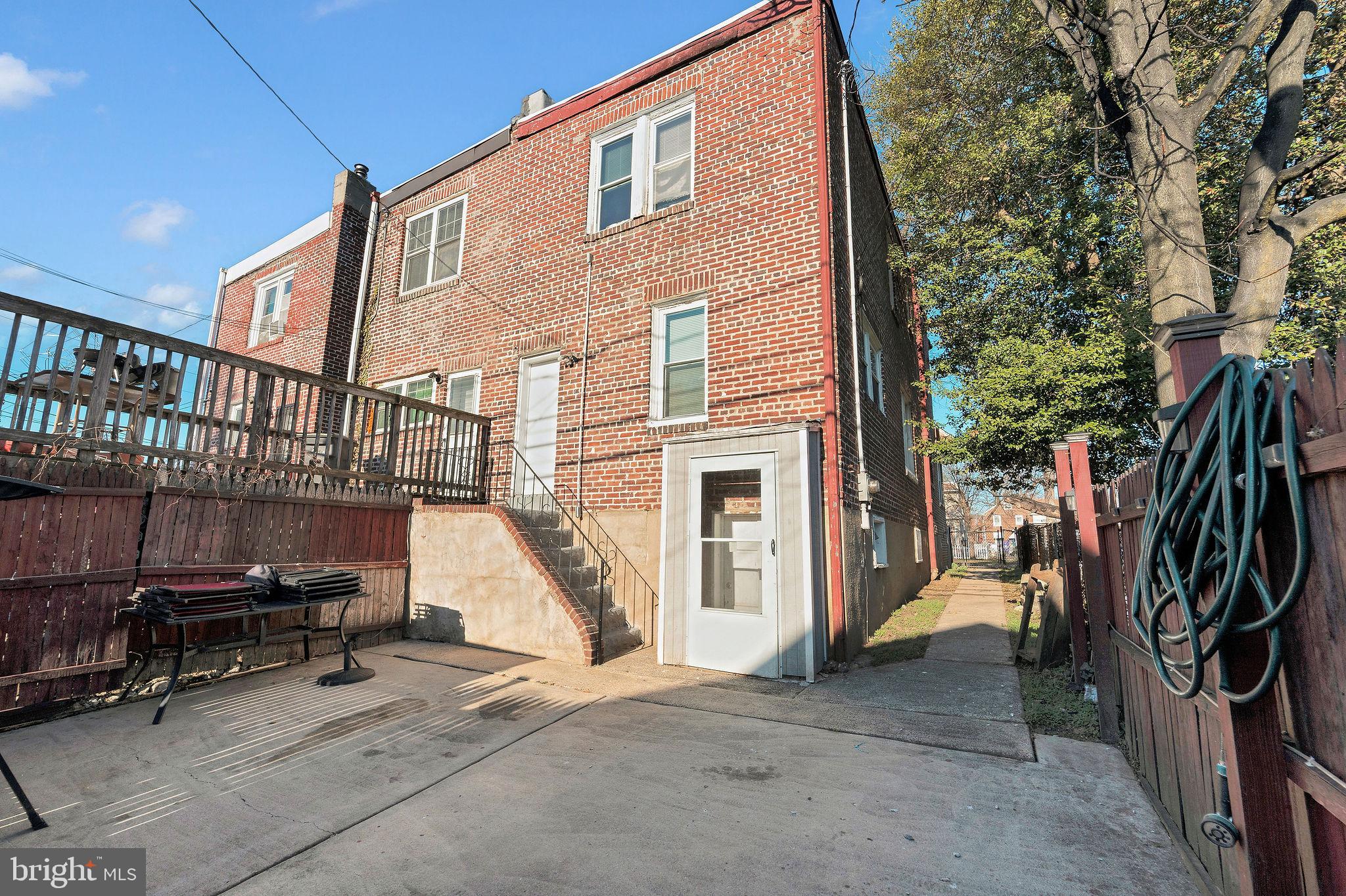 2791 Yorkship Road Camden, NJ 08104 - Photo 28 of 33 a view of a house with a barbeque and wooden stairs