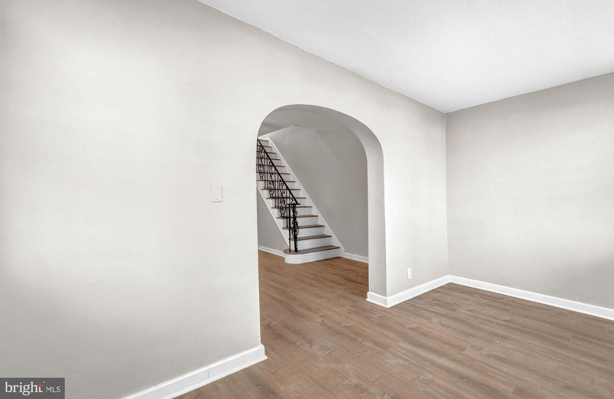 2791 Yorkship Road Camden, NJ 08104 - Photo 5 of 33 a view of a room with wooden floor and white walls