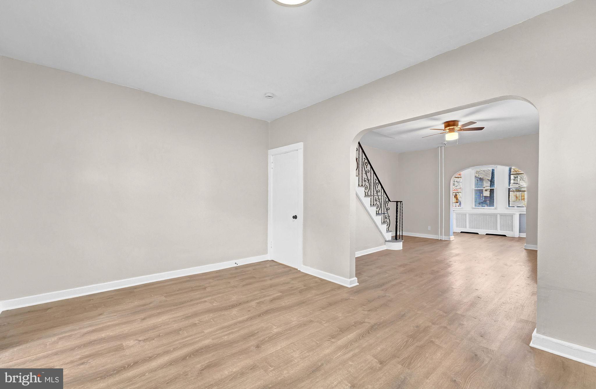 2791 Yorkship Road Camden, NJ 08104 - Photo 9 of 33 a view of a livingroom with wooden floor and stairs