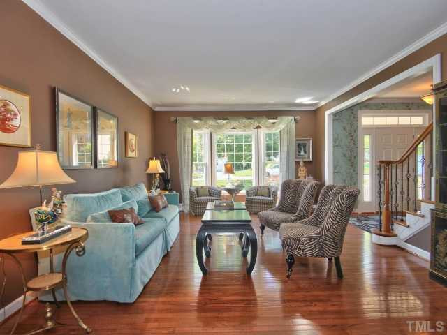 1817 Wescott Drive Raleigh, NC 27614 - Photo 3 of 25 Wonderful living room with hardwoods, bay window and crown molding. Room is open to the dining room as well! Living Room