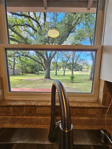 a view of a room that has a large window