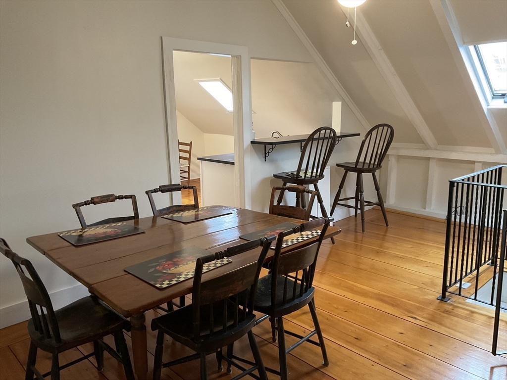 1 Middle Street, Unit 3 Marblehead, MA 01945 - Photo 6 of 16 a view of a dining room with furniture and wooden floor
