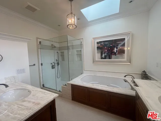 a spacious bathroom with a granite countertop tub sink and mirror