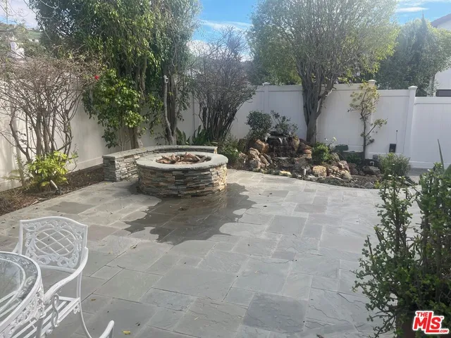 a view of a backyard of the house