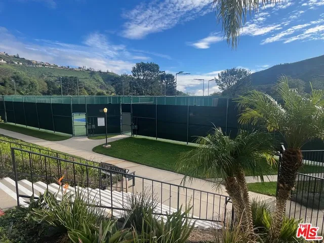 a view of a balcony and yard