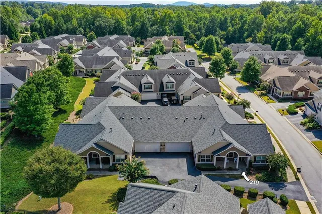 a view of a swimming pool with a yard