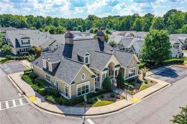a swimming pool with outdoor seating and yard