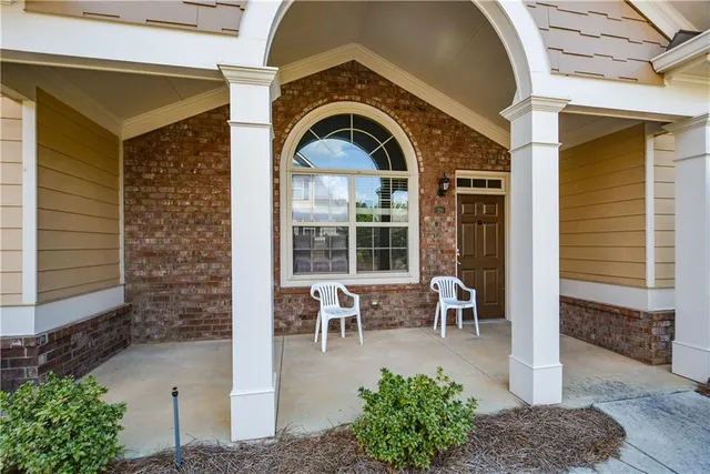 a front view of a house with outdoor seating