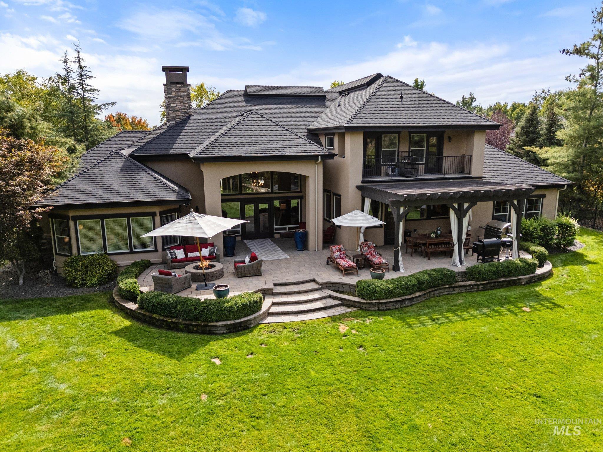 226 East Riversedge Drive Eagle, ID 83616 - Photo 3 of 50 Rear view of house with outdoor lounge area, a patio area, stucco siding, and a yard