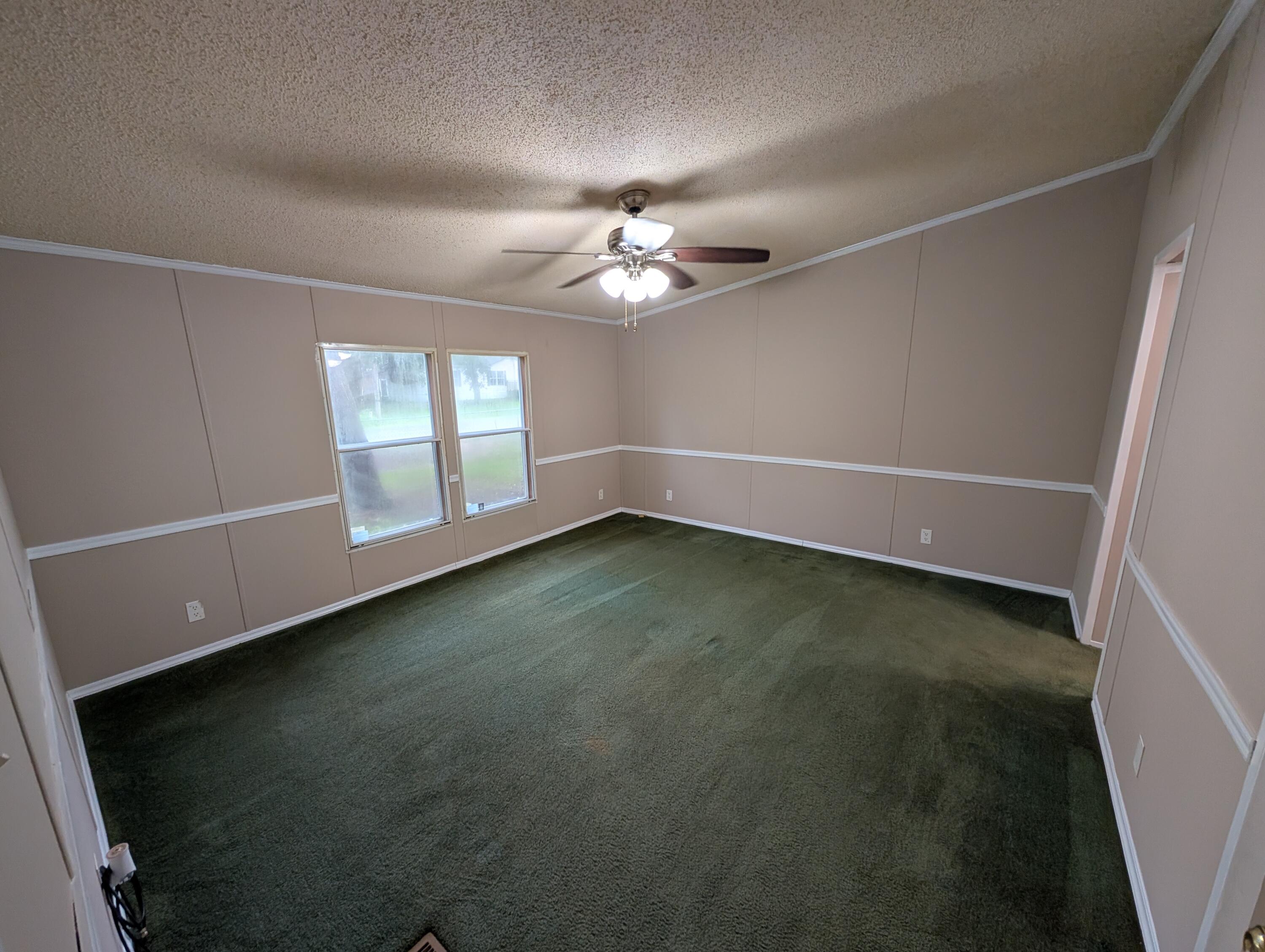 157 East Harborview Road Santa Rosa Beach, FL 32459 - Photo 17 of 27 a view of an empty room with a window