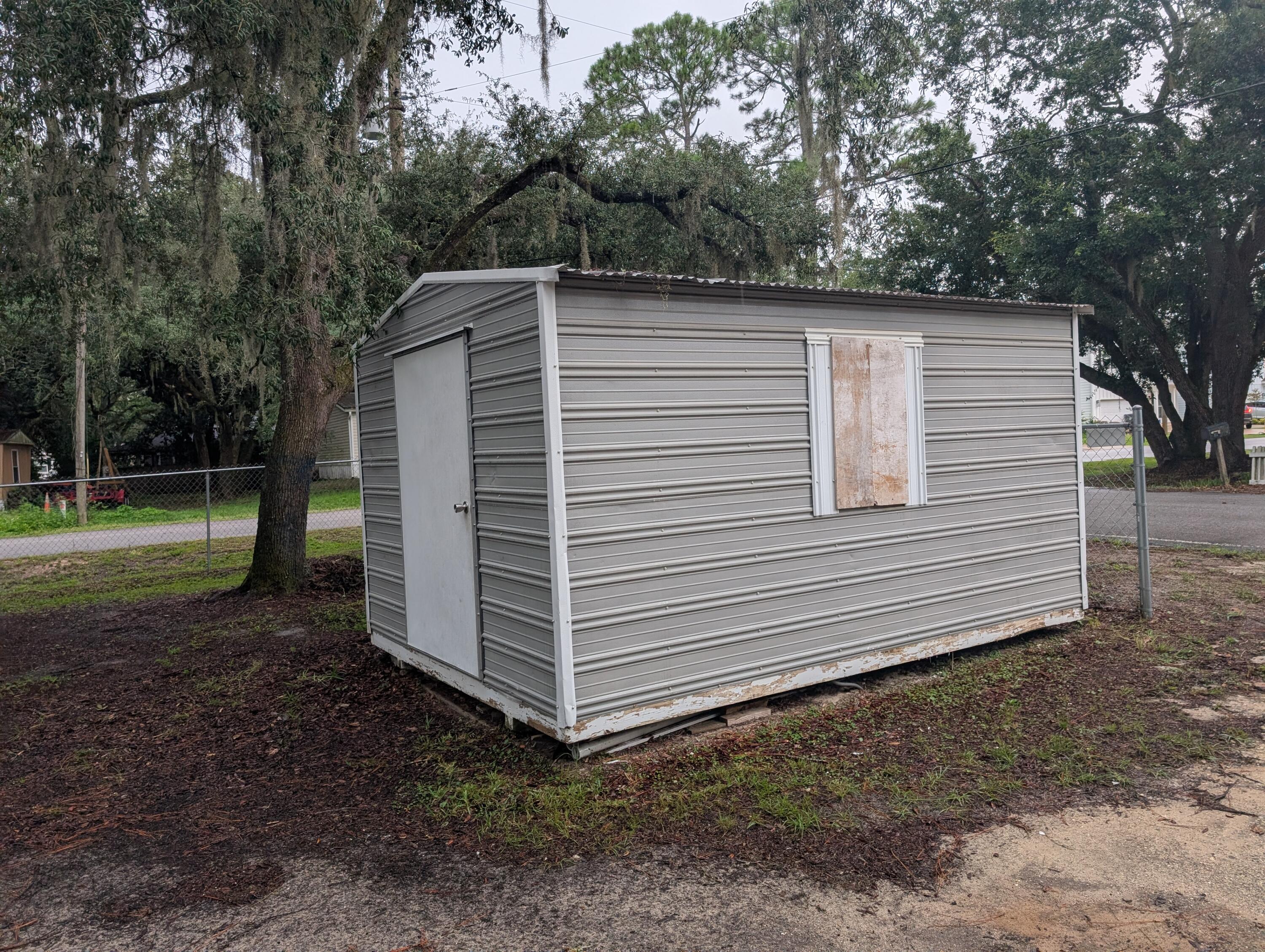 157 East Harborview Road Santa Rosa Beach, FL 32459 - Photo 3 of 27 a front view of a house with a yard