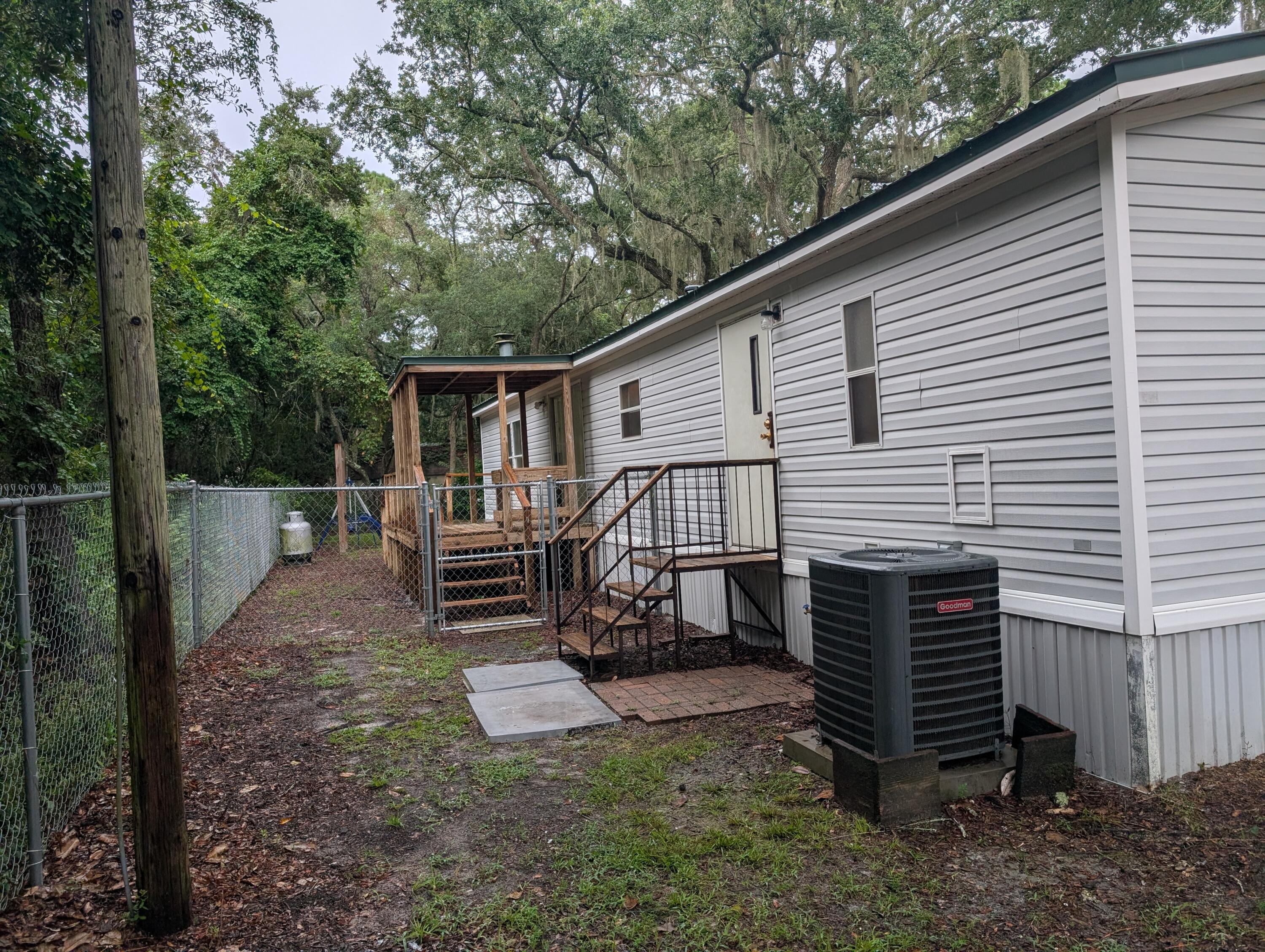 157 East Harborview Road Santa Rosa Beach, FL 32459 - Photo 6 of 27 a view of a house with a yard