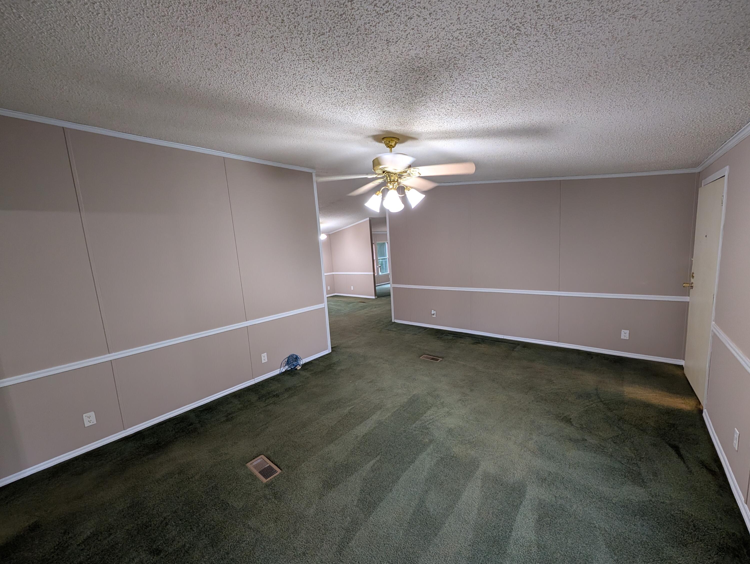 157 East Harborview Road Santa Rosa Beach, FL 32459 - Photo 8 of 27 a view of a livingroom with a ceiling fan and window