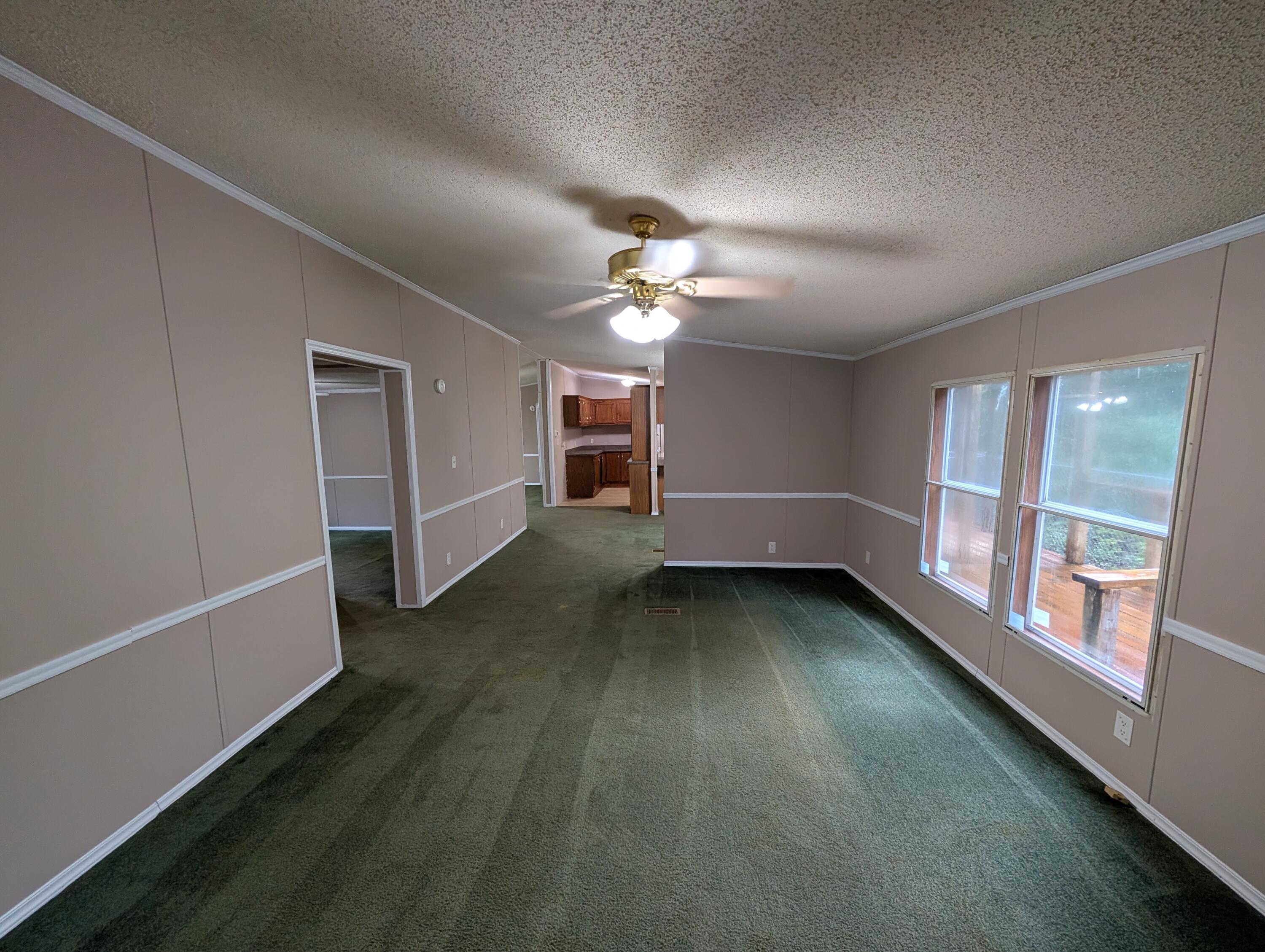 157 East Harborview Road Santa Rosa Beach, FL 32459 - Photo 10 of 27 wooden floor in an empty room with a window