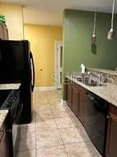 a view of a dining room with furniture and window