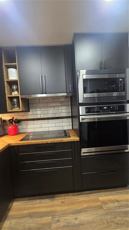 406 Lennox Road West Palm Harbor, FL 34683 - Photo 12 of 40 a kitchen with stove and cabinets