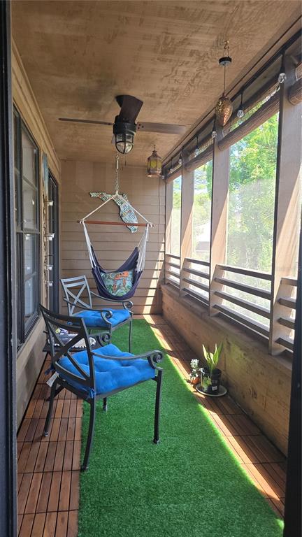 406 Lennox Road West Palm Harbor, FL 34683 - Photo 19 of 40 a living room with patio furniture and a floor to ceiling window
