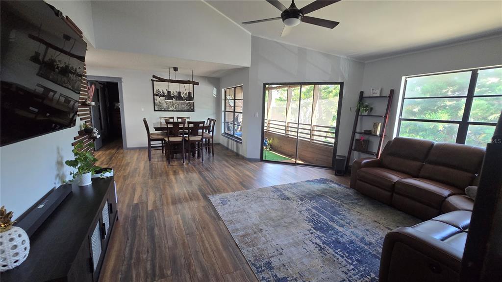 406 Lennox Road West Palm Harbor, FL 34683 - Photo 2 of 40 a living room with furniture and a wooden floor