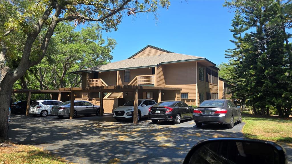 406 Lennox Road West Palm Harbor, FL 34683 - Photo 24 of 40 a car parked in front of a house