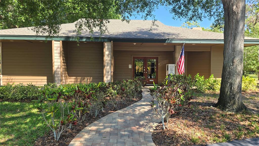 406 Lennox Road West Palm Harbor, FL 34683 - Photo 30 of 40 front view of a house with a garden
