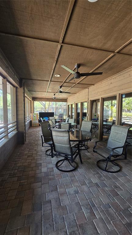 406 Lennox Road West Palm Harbor, FL 34683 - Photo 34 of 40 a outdoor space with chairs a couch and large window