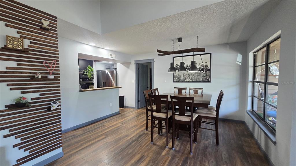 406 Lennox Road West Palm Harbor, FL 34683 - Photo 5 of 40 a dining room with furniture and window