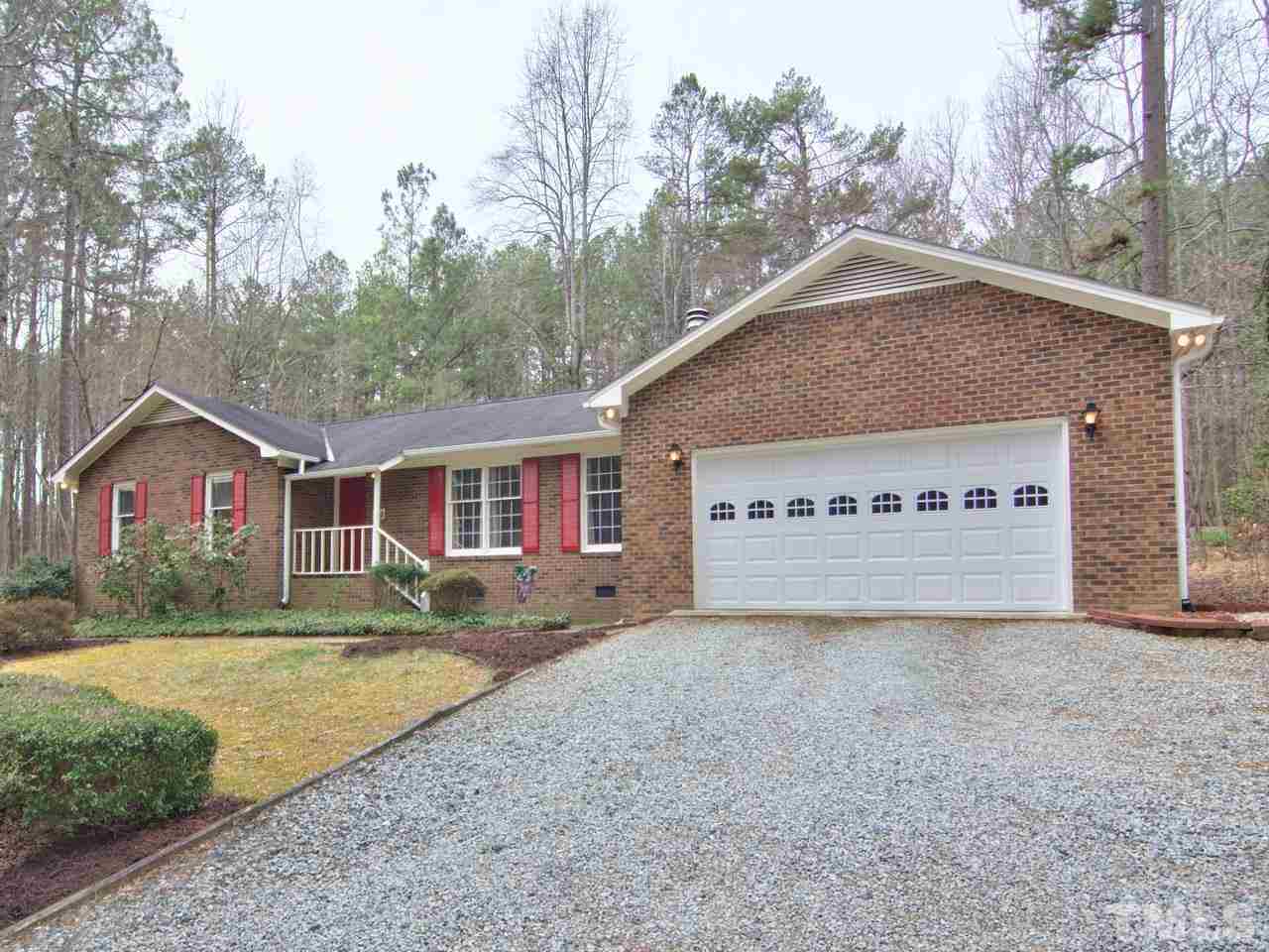 5701 Geoffrey Road Durham, NC 27712 - Photo 1 of 23 a view of a house with a yard