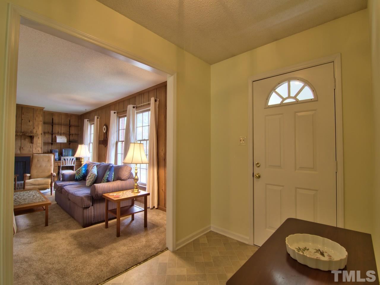 5701 Geoffrey Road Durham, NC 27712 - Photo 13 of 23 a living room with furniture and a window
