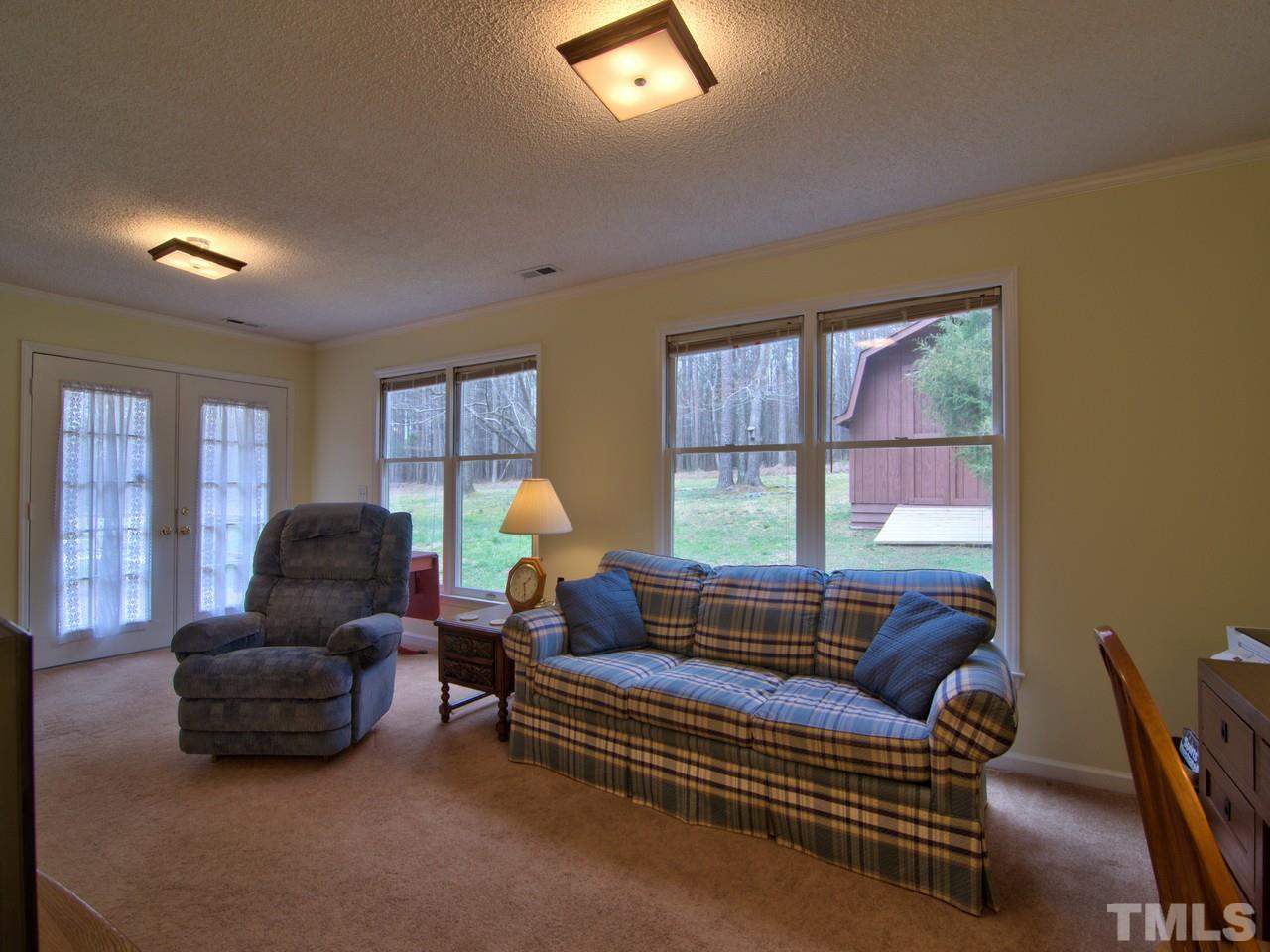 5701 Geoffrey Road Durham, NC 27712 - Photo 17 of 23 a living room with furniture and a window
