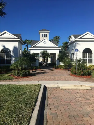 a front view of a house with a yard and a garage