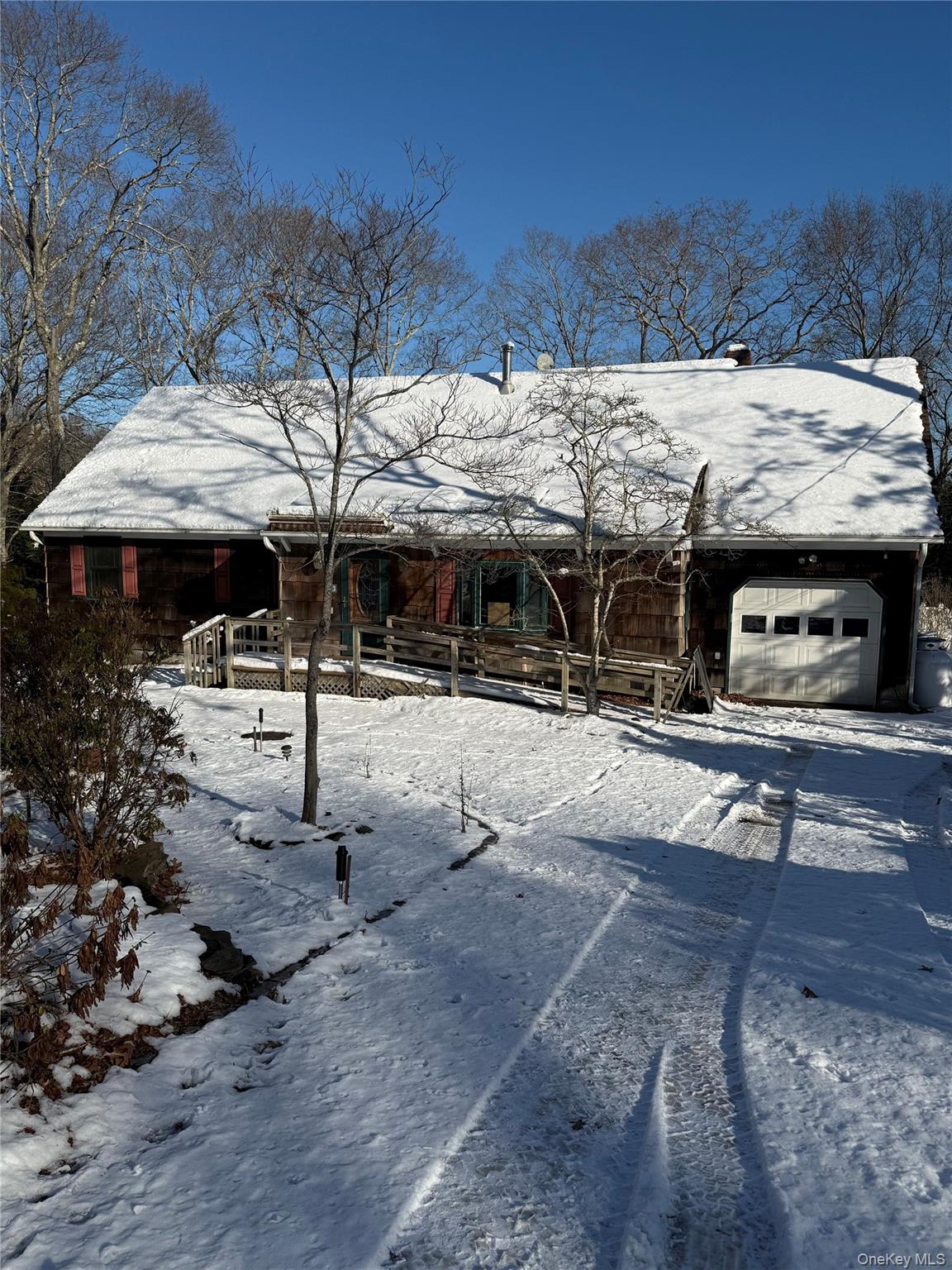 3 Fairview Road Hampton Bays, NY 11946 - Photo 3 of 3 View of front of home featuring a chimney