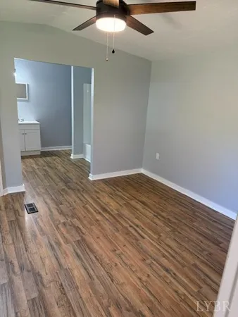 a view of a livingroom with wooden floor
