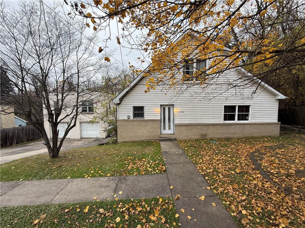 1006-1008 Olive Avenue Natrona Heights, PA 15065 - Photo 1 of 26 a backyard of a house with large trees