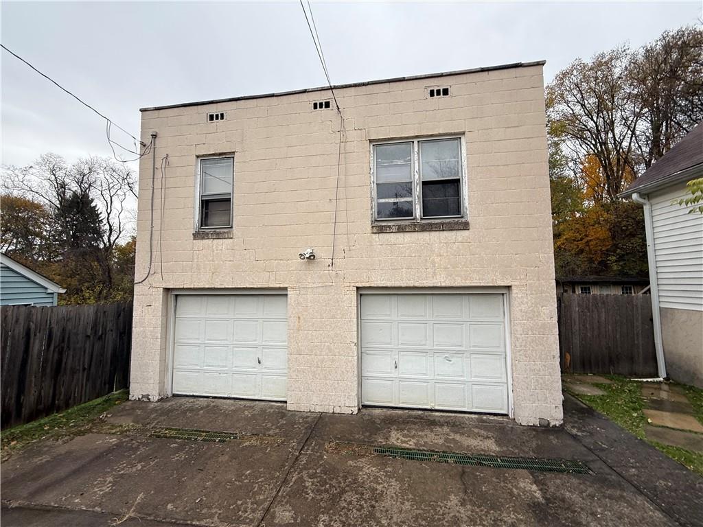 1006-1008 Olive Avenue Natrona Heights, PA 15065 - Photo 21 of 26 a front view of a house with a garage